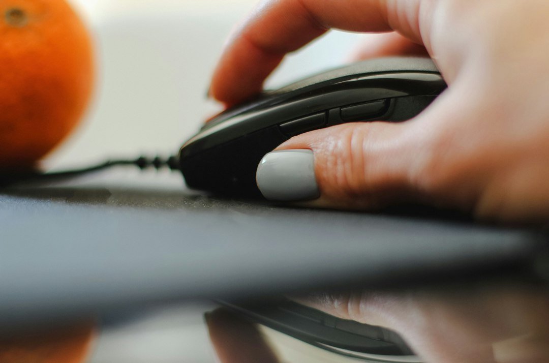 How to Choose and Use a Click Counter for Gaming and Productivity - hand clicking mouse button close up
