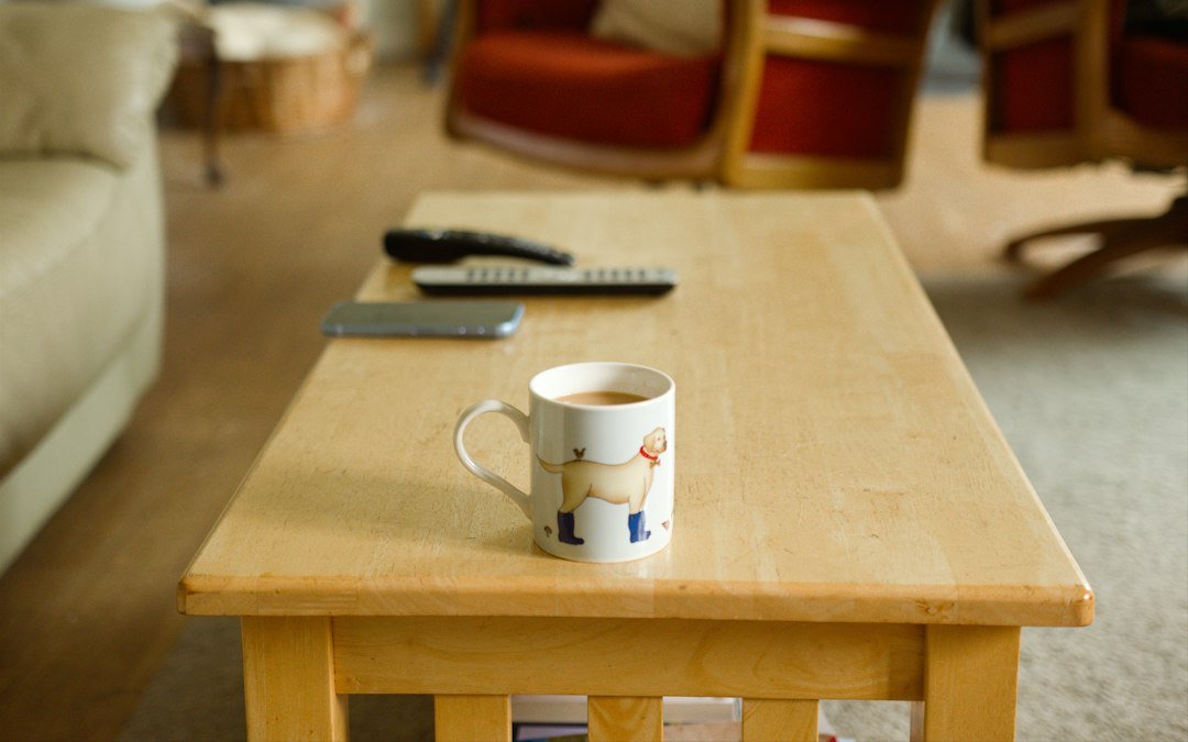 What Makes Good Handheld Games? A 2026 Guide - handheld gaming console on a coffee table